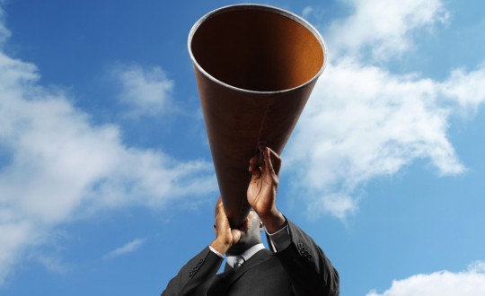 Man Holding Loudspeaker
